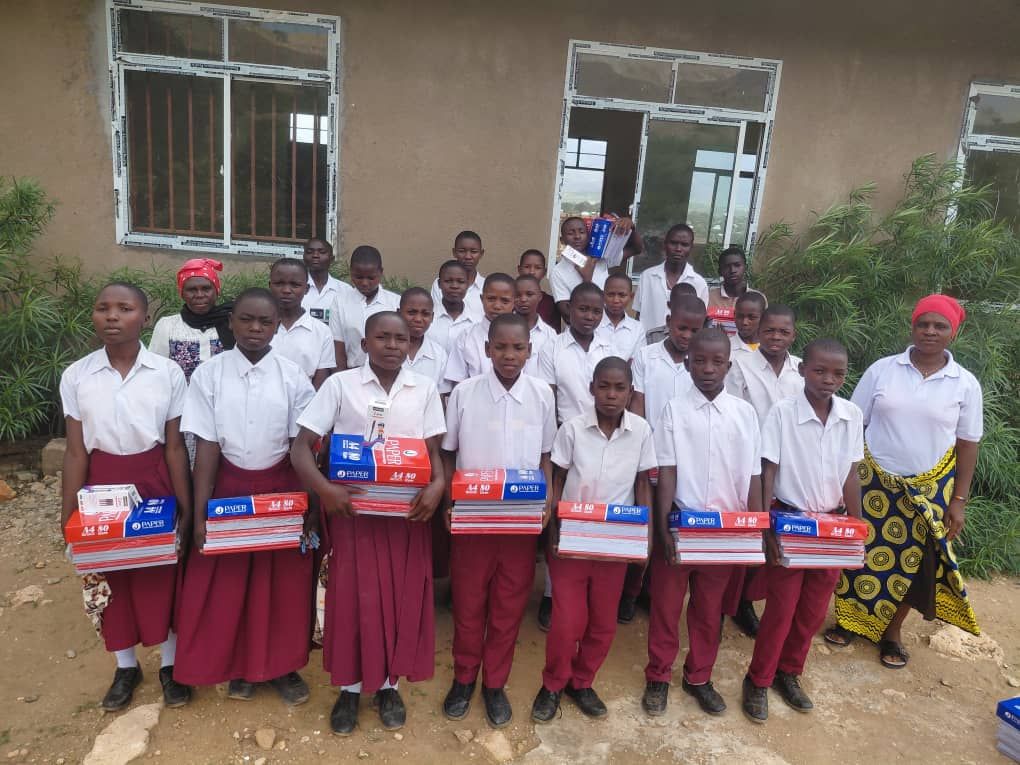 Students in maroon and white uniforms with their new supplies, 2026